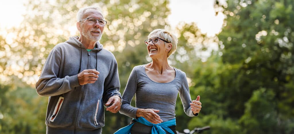 Healthy mature couple exercising togeher